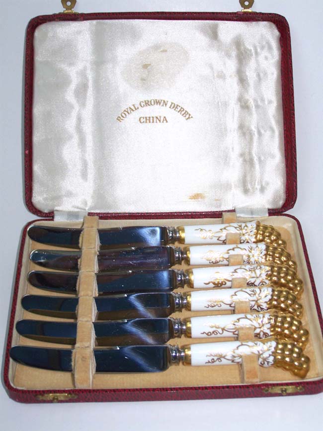 A cased set of six ROYAL CROWN DERBY butter knives with Princess Margaret connection circa 1953-1958